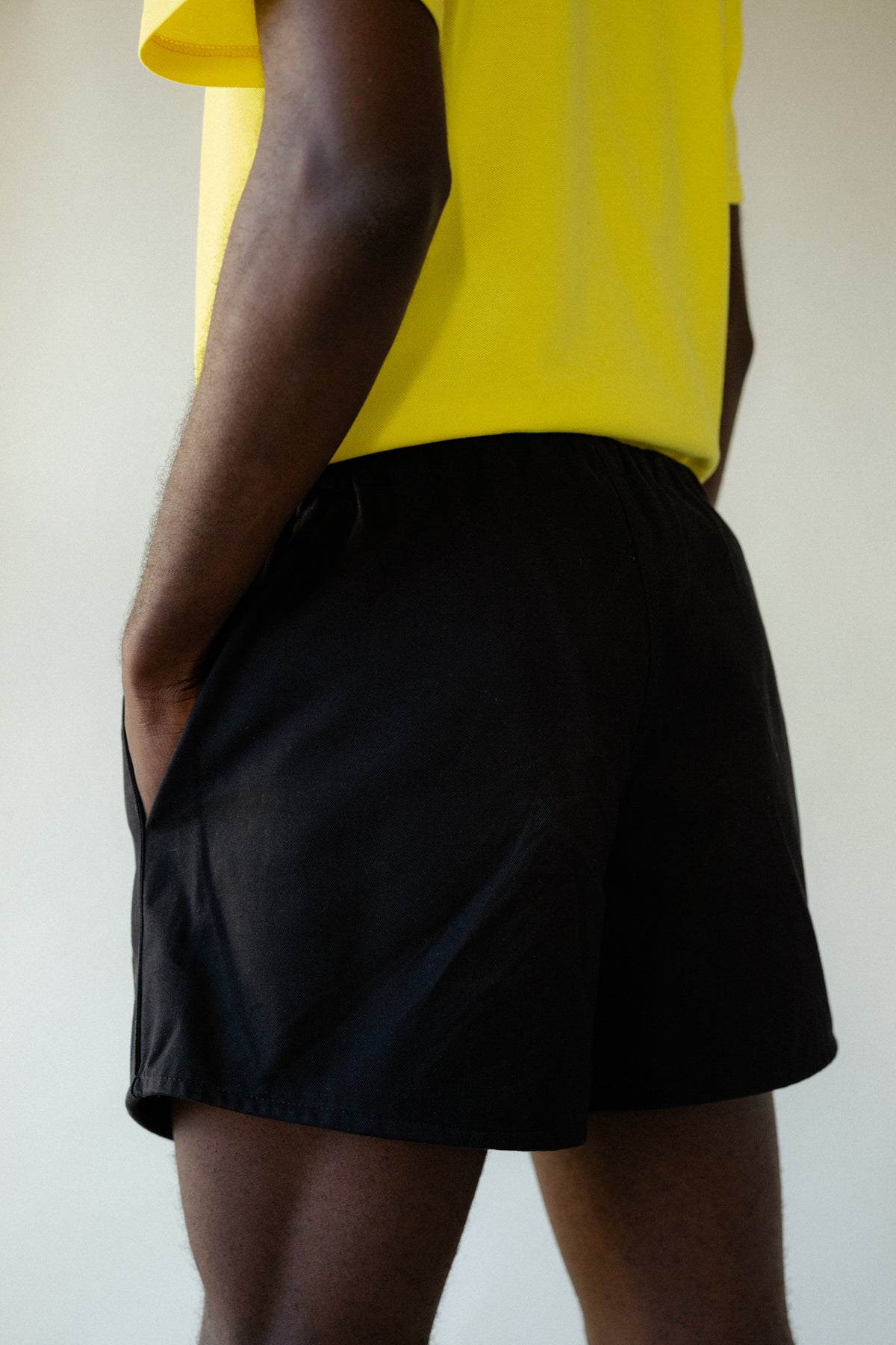 
            Image showing back of black male wearing heavyweight sports short plastic free in black close up