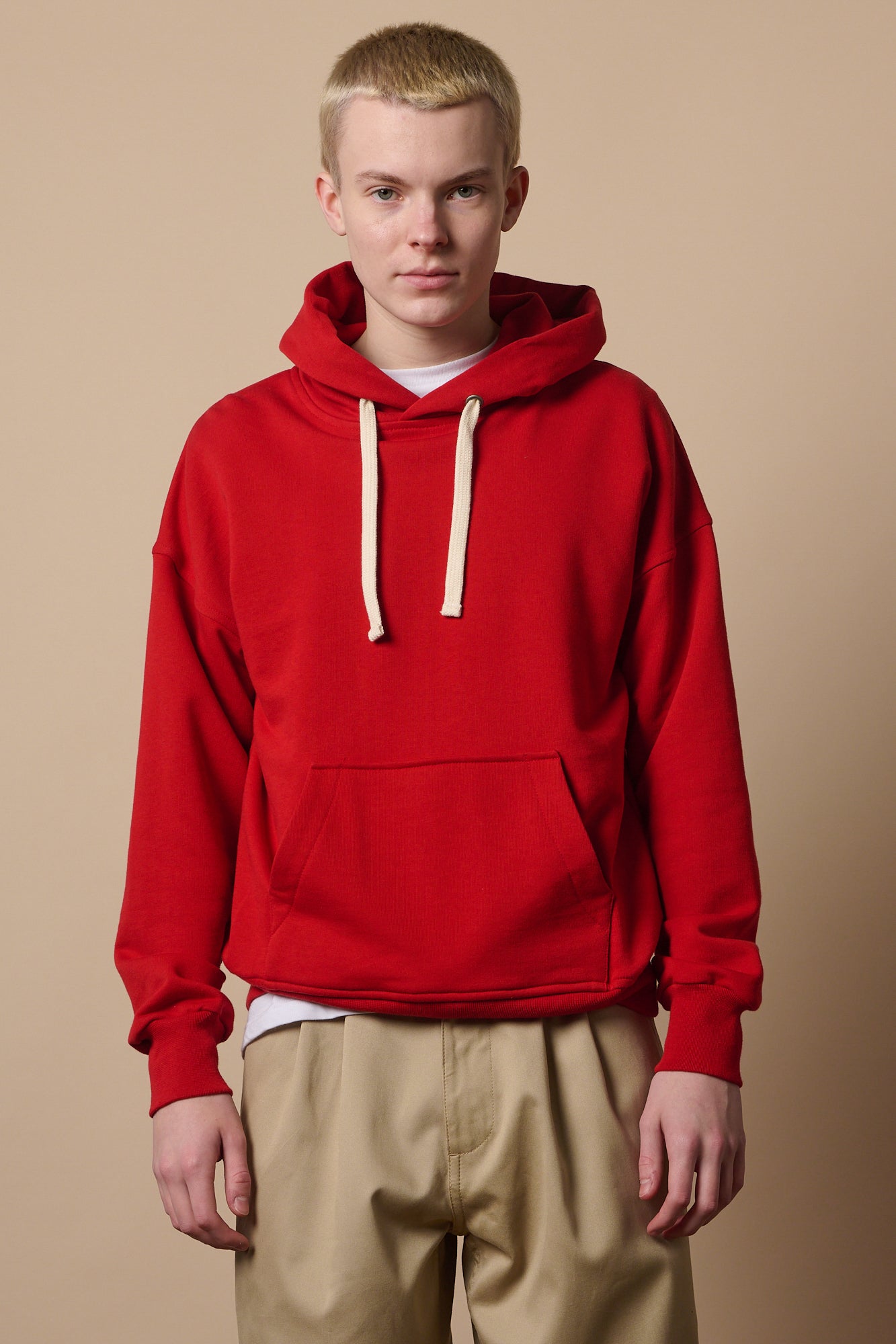 Thigh u image of white male wearing crimson hooded sweatshirt 