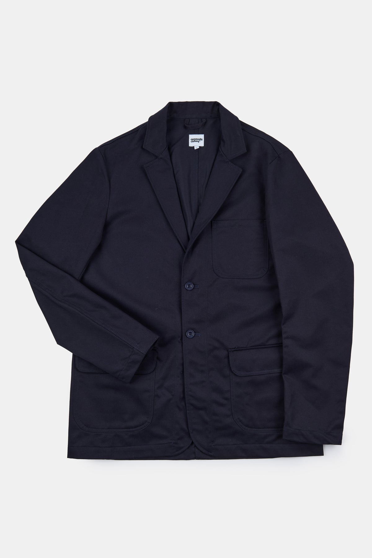 Flatlay shot of James single breasted blazer in dark navy with a two button fastening and three external front pockets