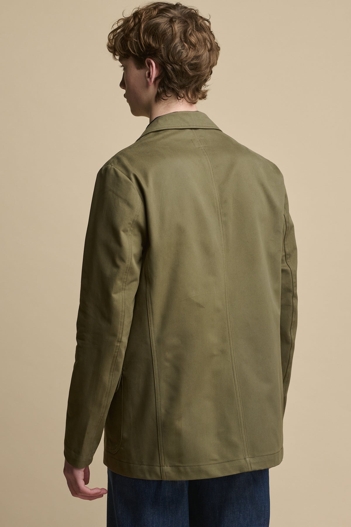 Thigh up image of the back of male wearing Men's James Single Breasted Blazer in olive