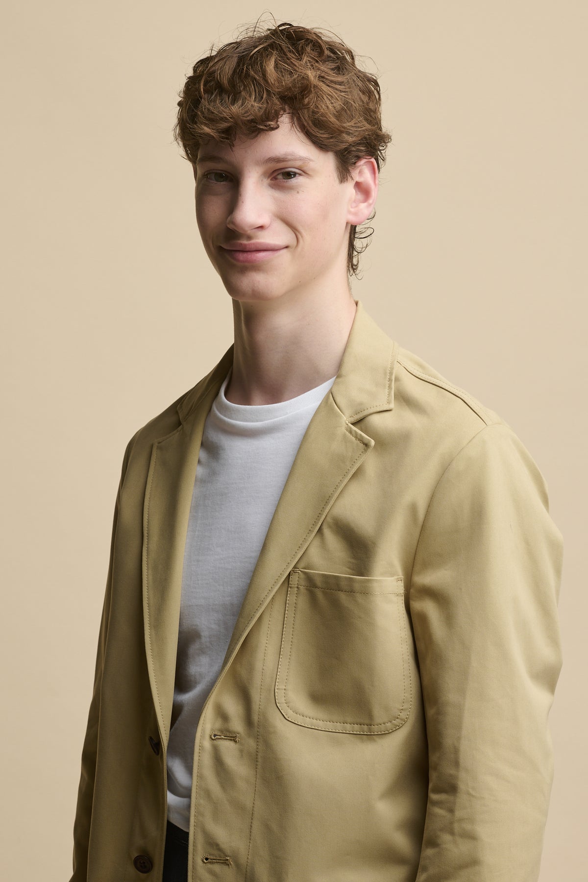 
            Waist up image of male wearing Men&#39;s James Single Breasted Blazer in stone over a short sleeve white t shirt