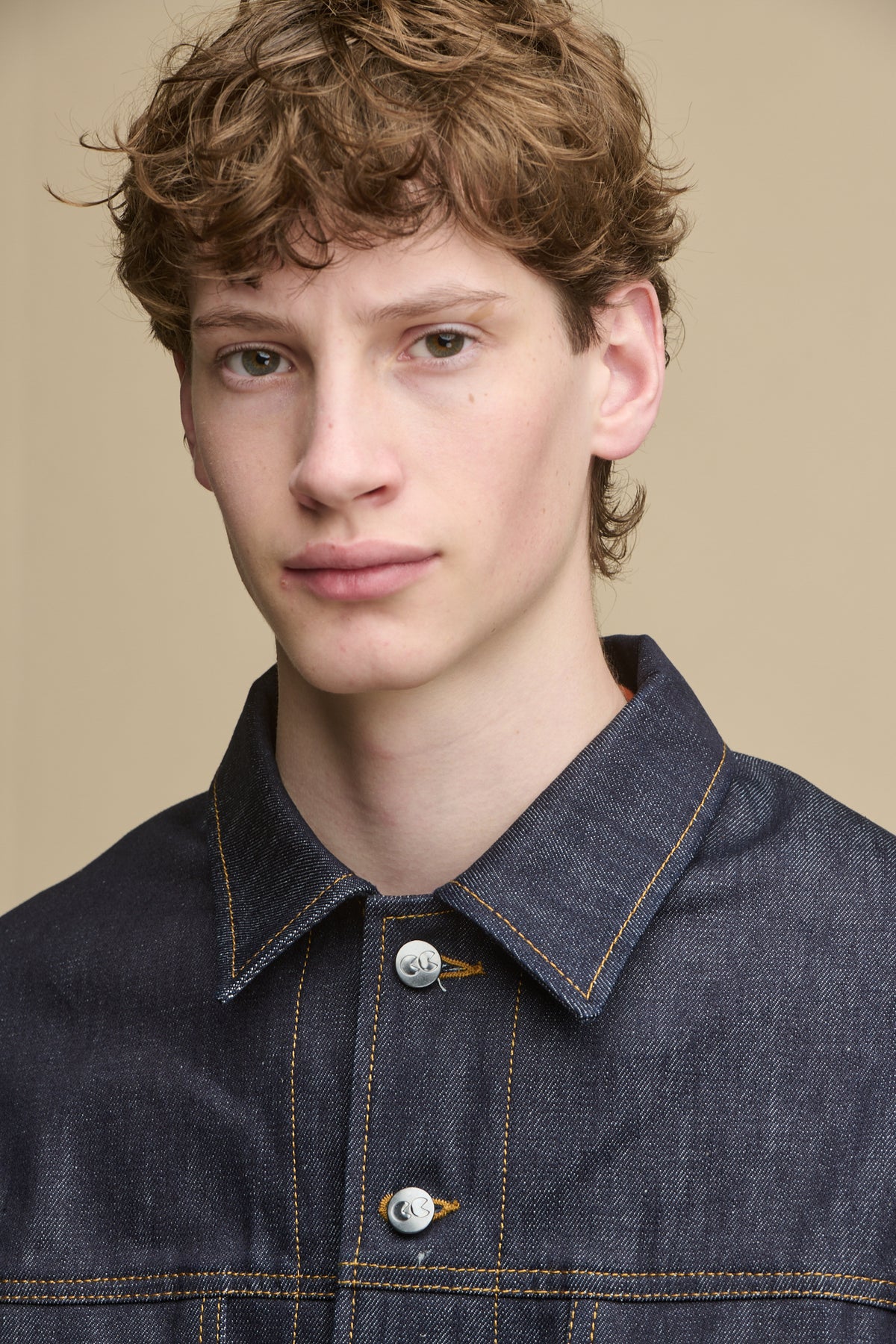 Portrait of male wearing Joe denim jacket in indigo