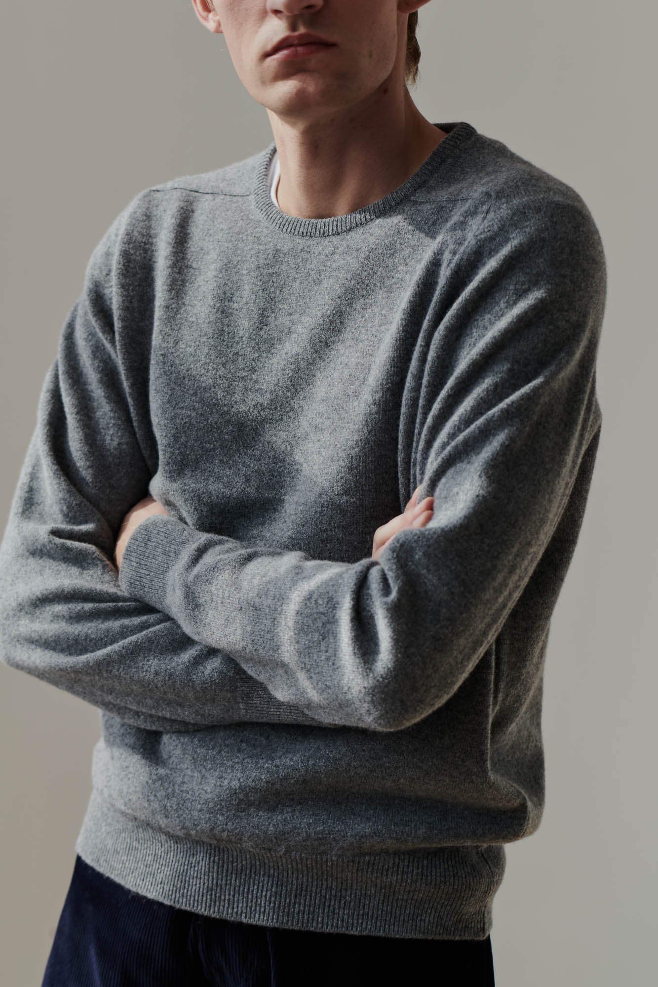 White male wearing grey lambswool crew neck