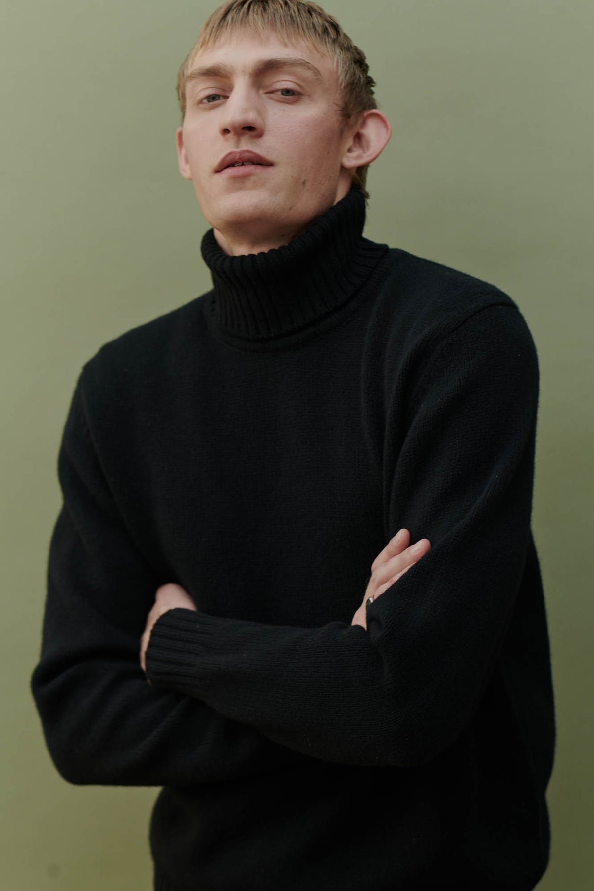 Male wearing Lambswool roll neck in black