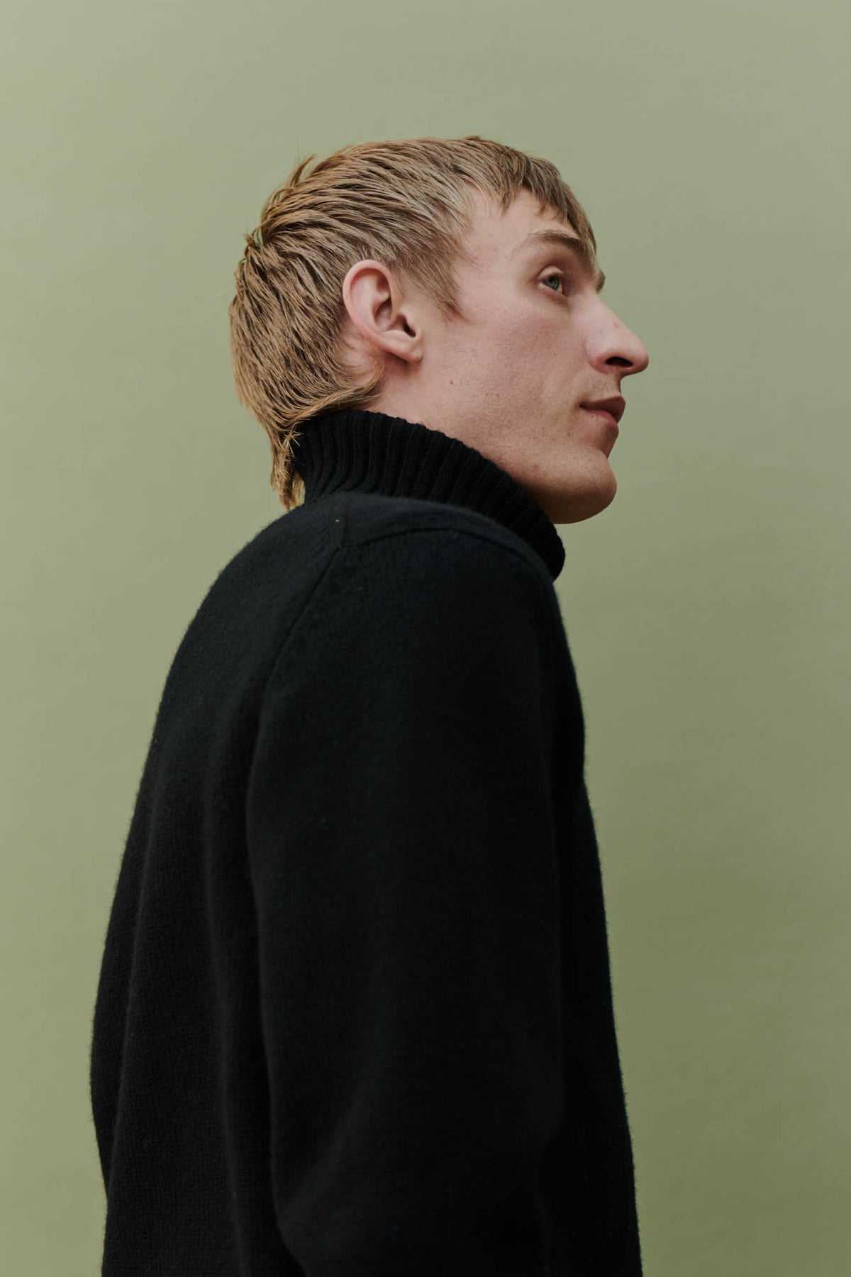 Male wearing Lambswool roll neck in black