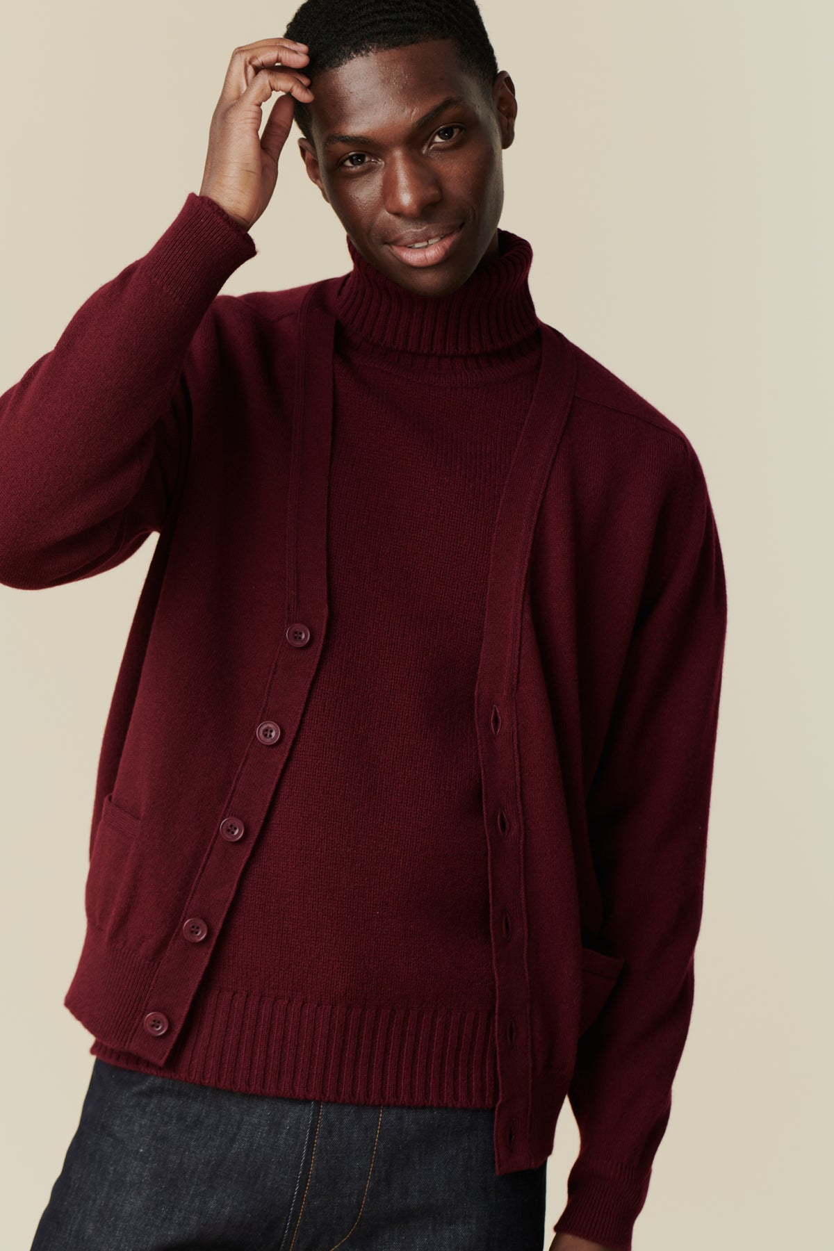 Male wearing lambswool crew neck in burgundy
