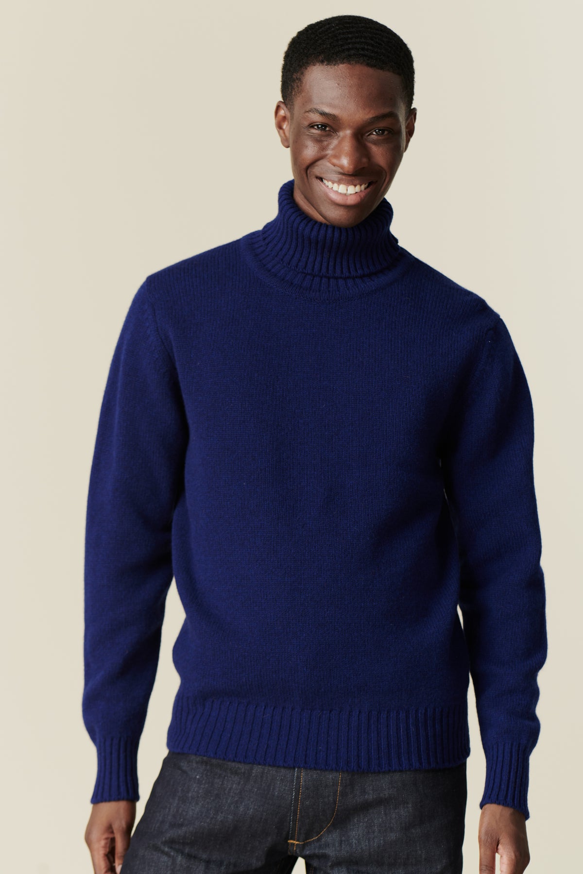 
            Smiley, black male wearing lambswool roll neck dark cobalt 
