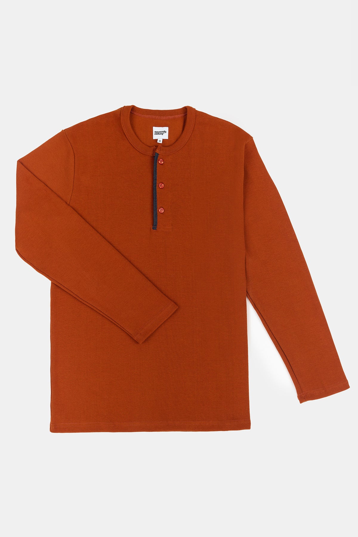 Flatlay product shot of men's long sleeve henley top in cinnamon