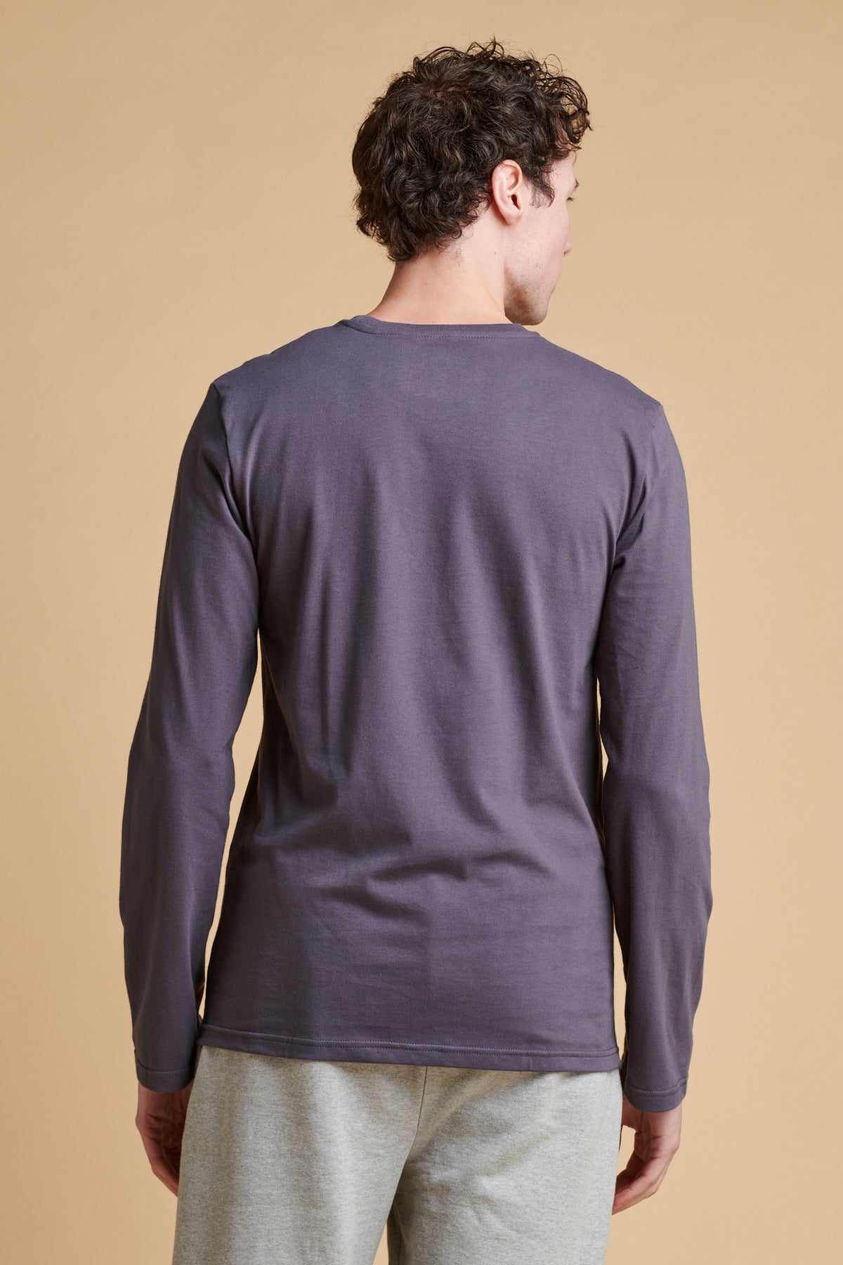 Male wearing long sleeve t-shirt in slate grey.