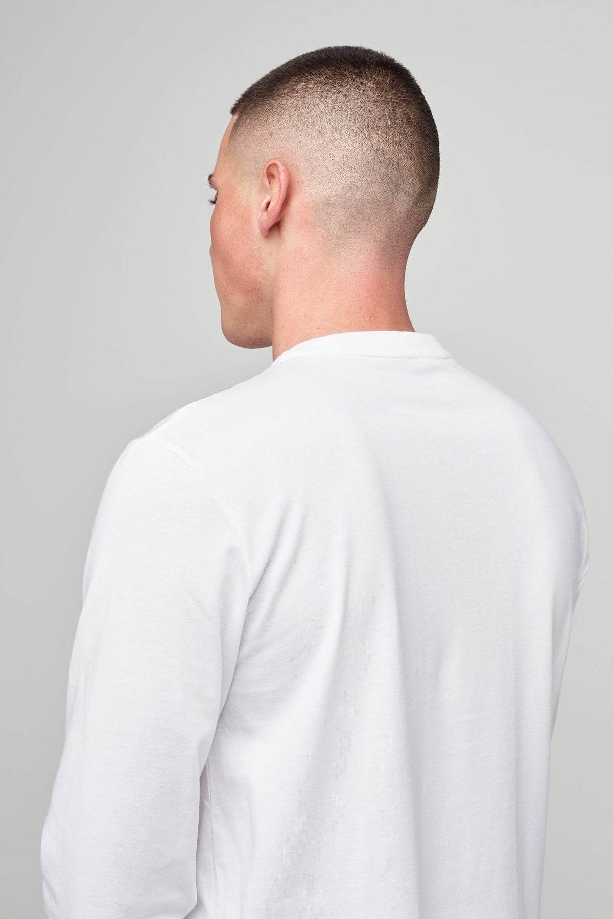 
            Brunet, white male wearing long sleeve t-shirt white 