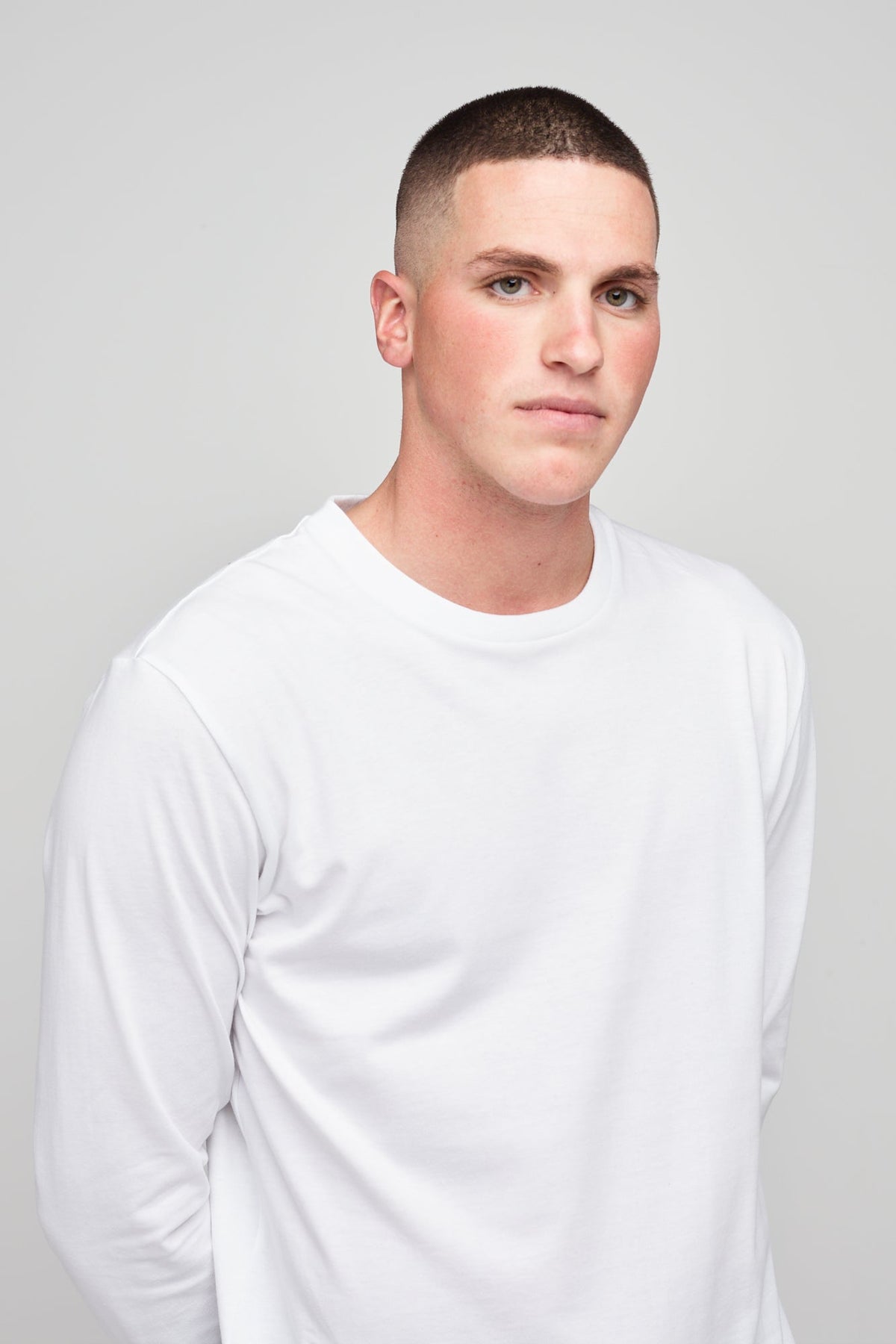 
            Brunet, white male wearing long sleeve t-shirt white  
