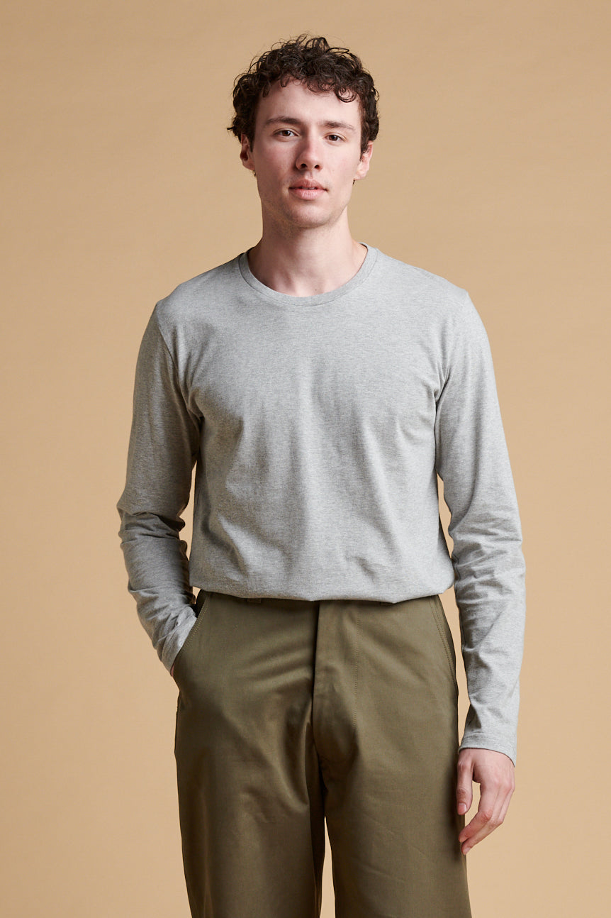Male wearing long sleeve t shirt in grey marl.