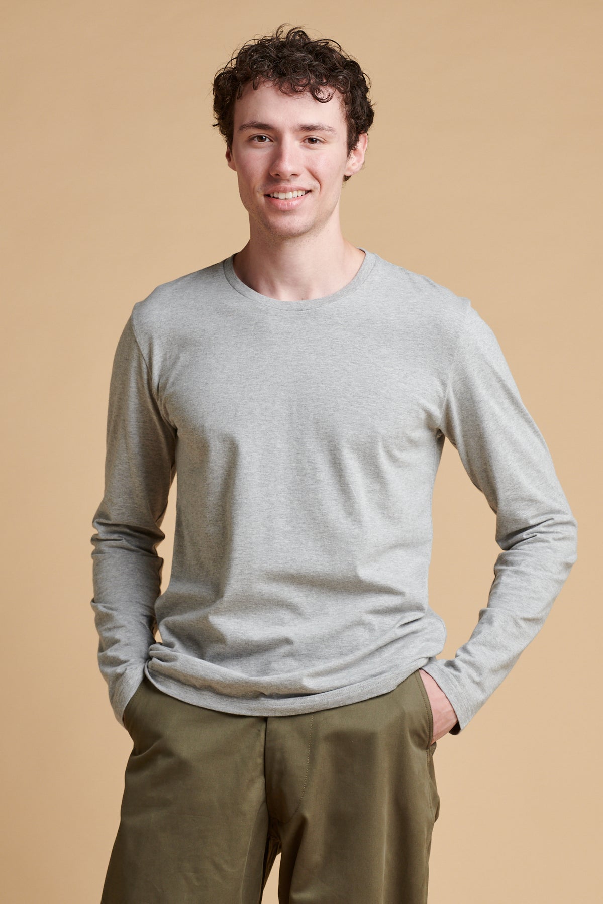 Male wearing long sleeve t shirt in grey marl.