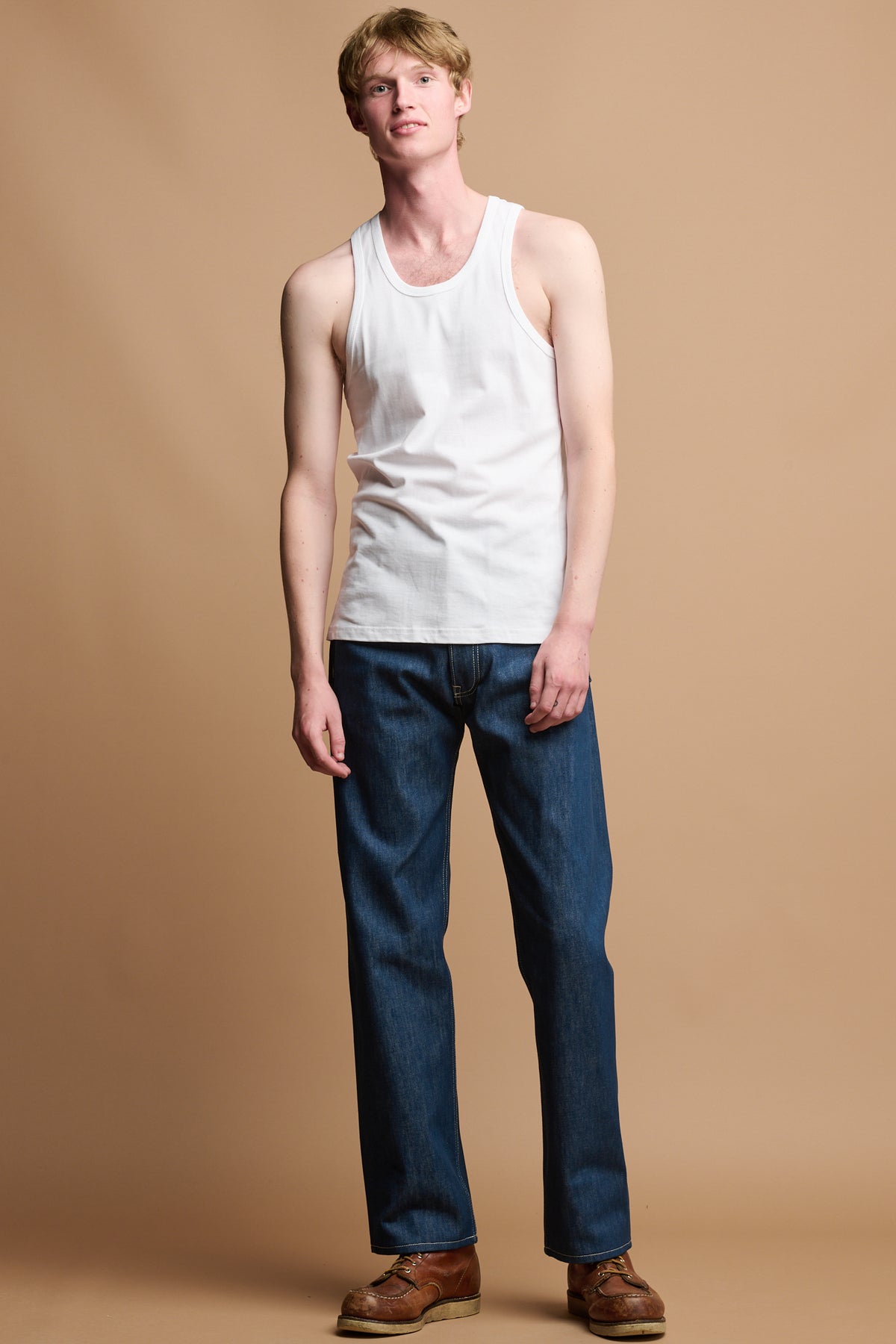 Male wearing Button fly arran jean in blue