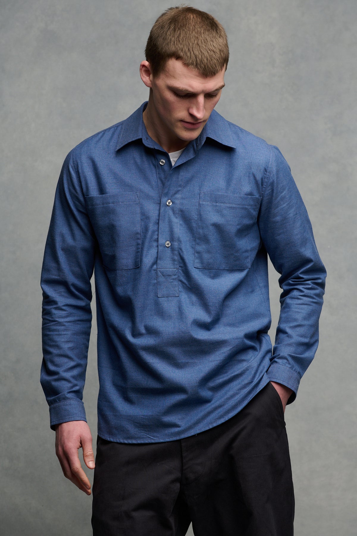 
            Thigh up front image of white male wearing Oli shirt in RAF blue paired with field trousers in navy