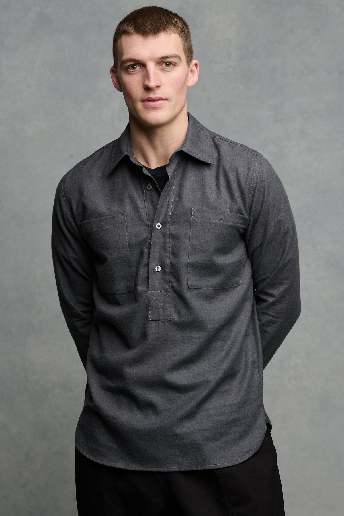 
            Thigh up image of the front of smiley male wearing Oli half placket lightweight brushed cotton shirt in slate