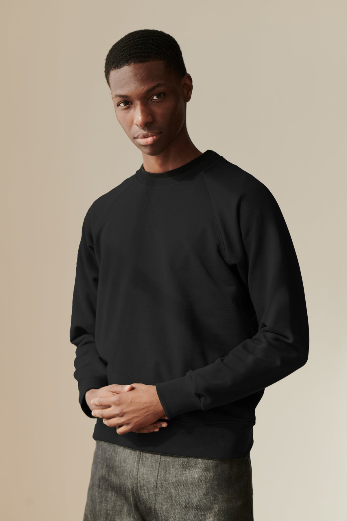 Male wearing raglan sweatshirt in Black