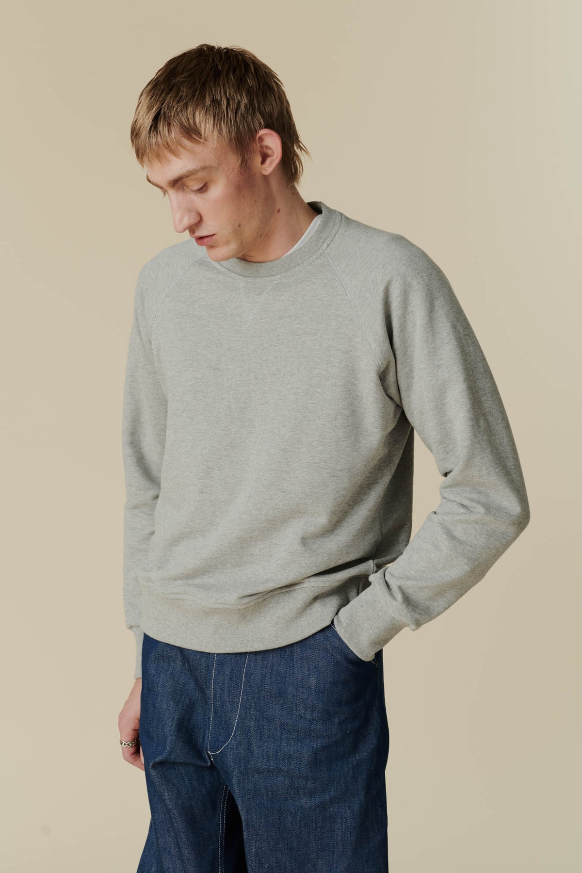 Male in raglan sweatshirt grey