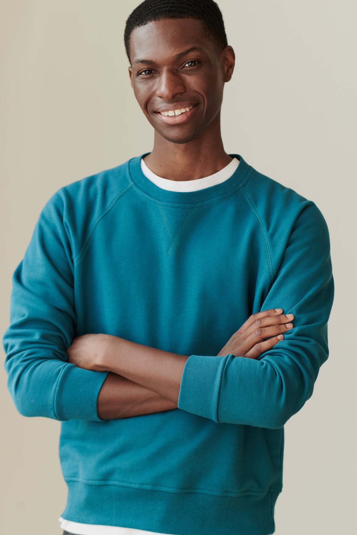 
            Front of male in men&#39;s raglan sweatshirt in teal