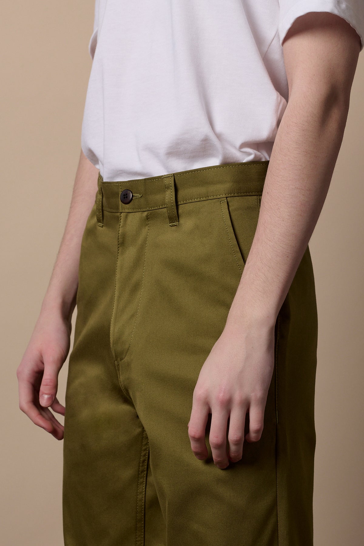 Front of male wearing relaxed chino in moss with belt loops and front pockets