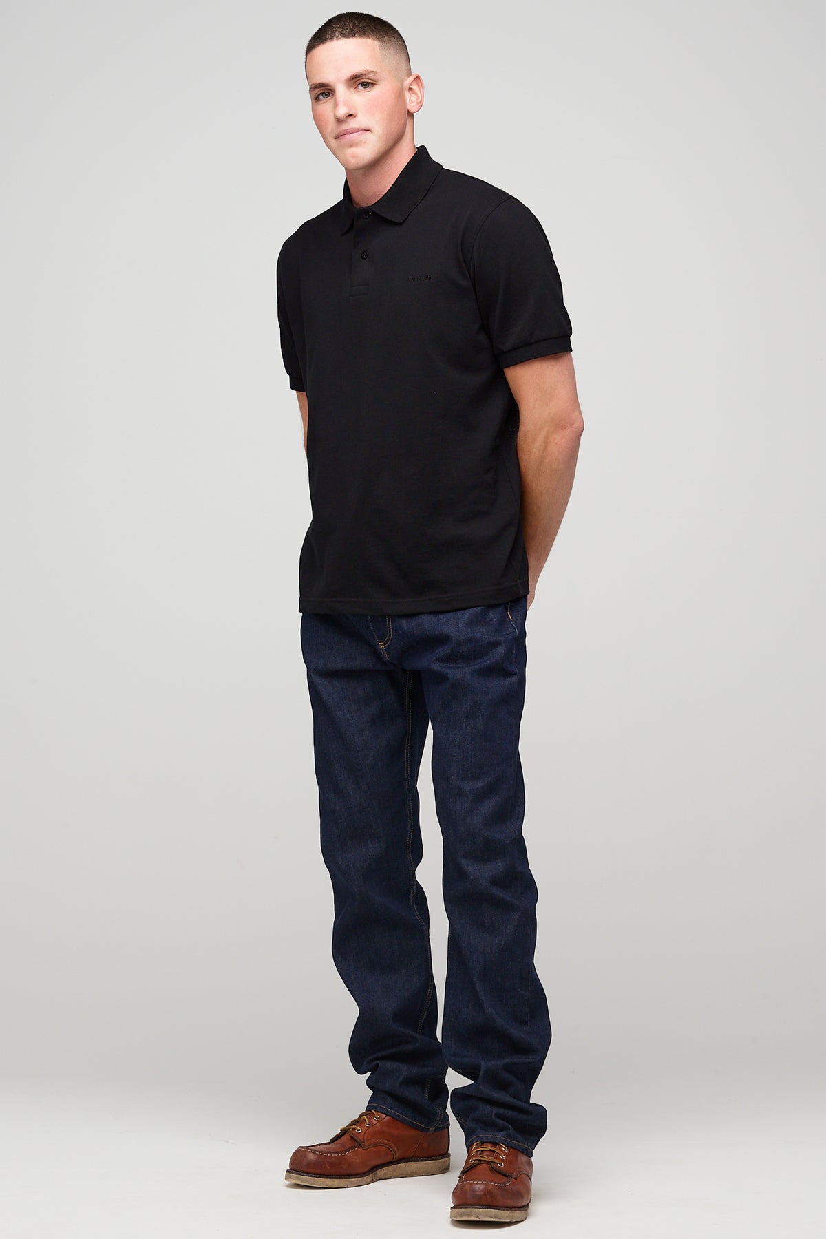 
            Male in short sleeve polo shirt - black