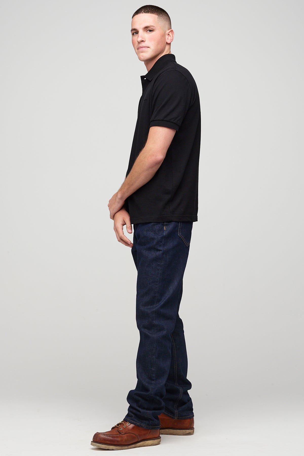 
            Male in short sleeve polo shirt - black