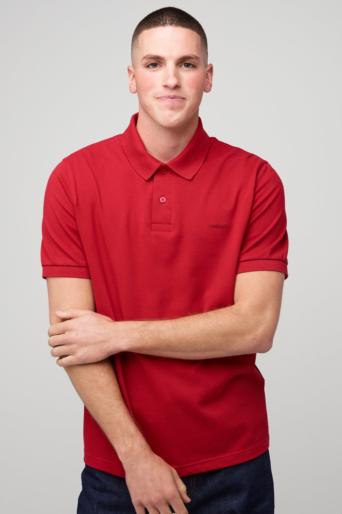 
            Brunnet male in short sleeve polo shirt crimson