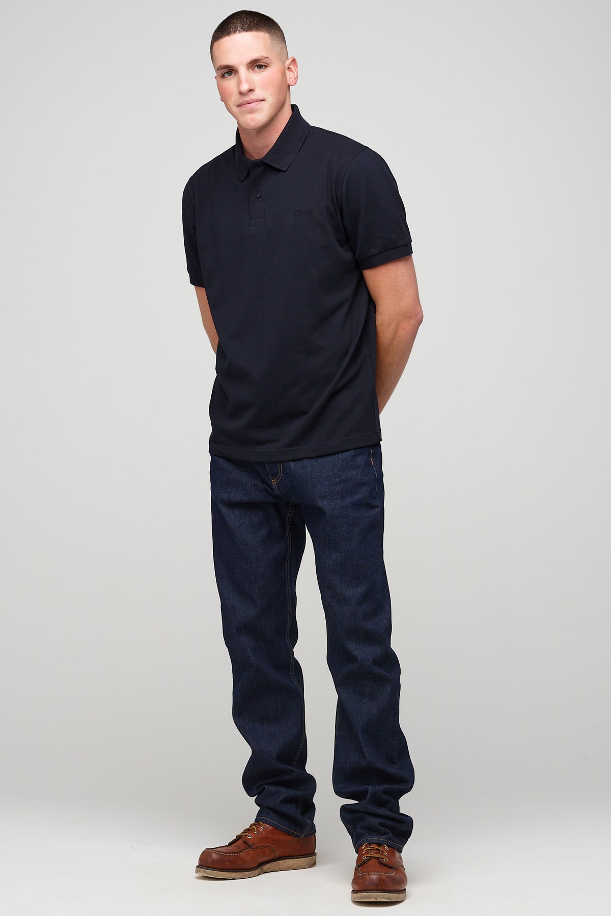 
            Brunet, white male in Short Sleeve Polo Shirt - Navy