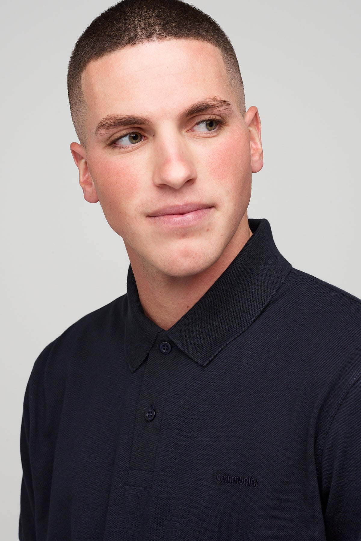 Brunet, white male in Short Sleeve Polo Shirt - navy