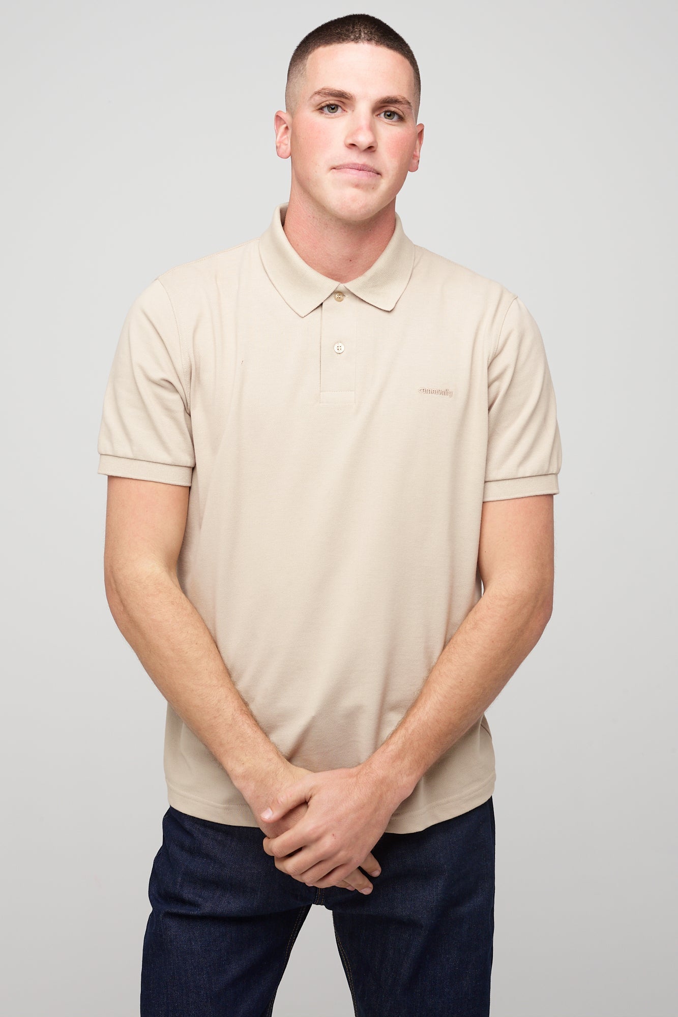 Brunet, white male in Short Sleeve Polo Shirt - Stone