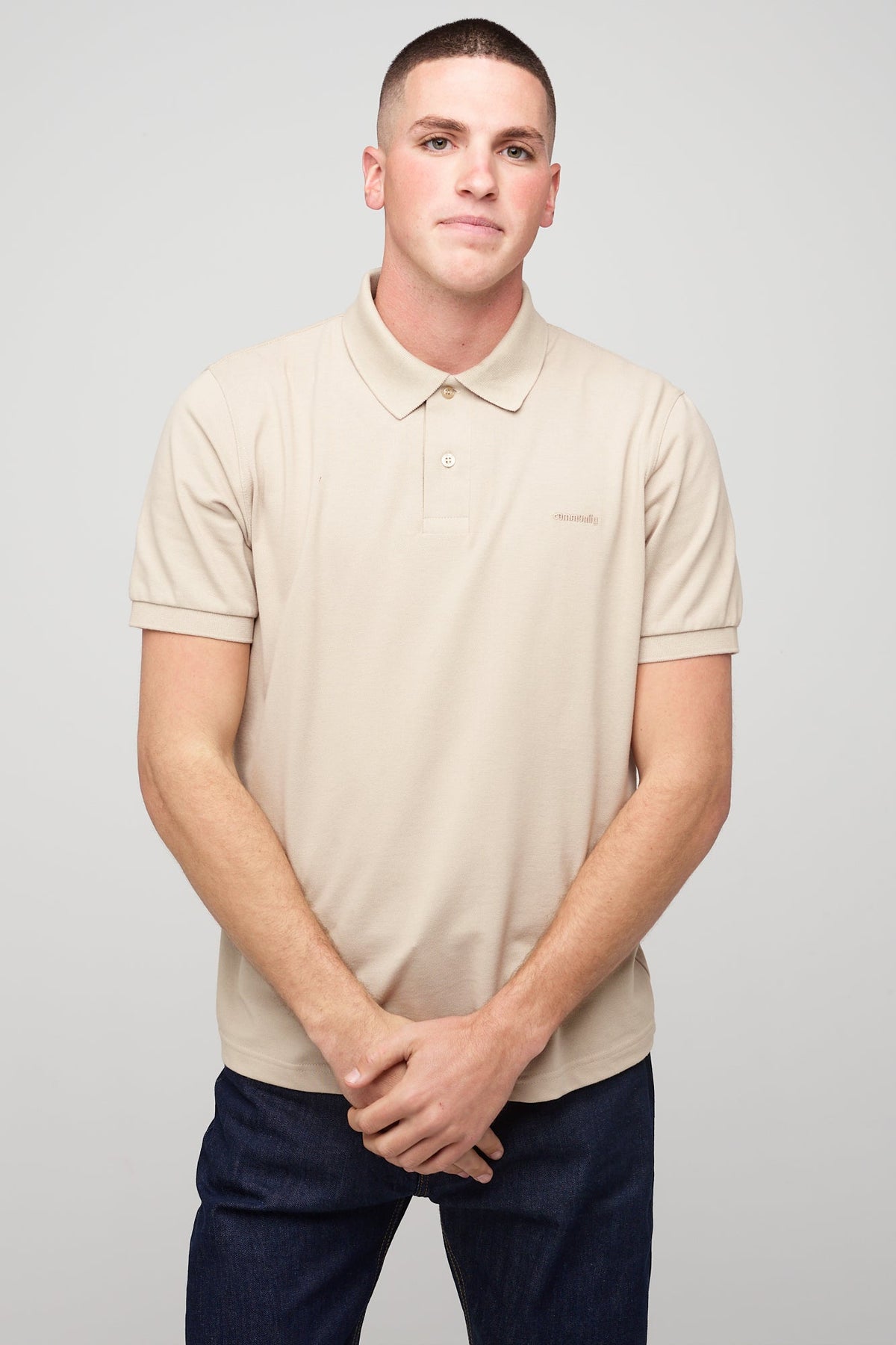 
            Brunet, white male in Short Sleeve Polo Shirt - Stone