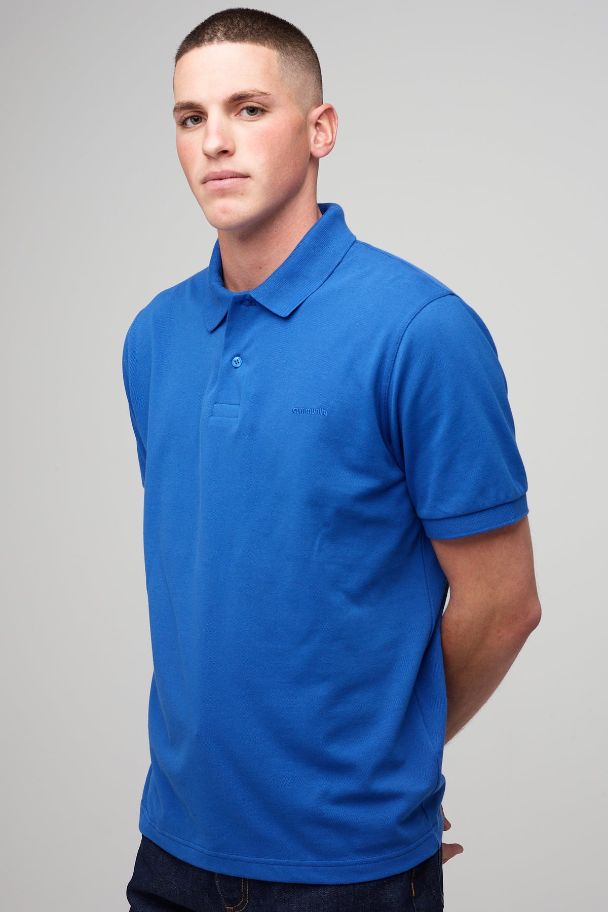 
            male in short sleeve polo shirt - cobalt