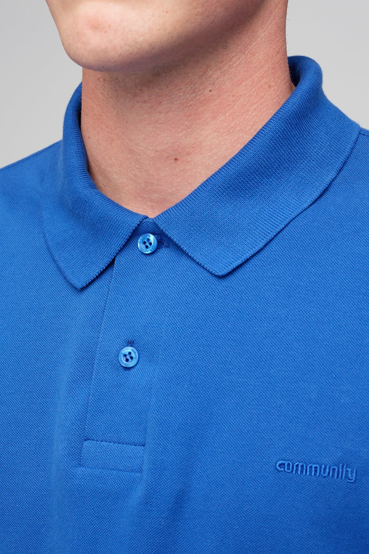 
            male in short sleeve polo shirt - cobalt