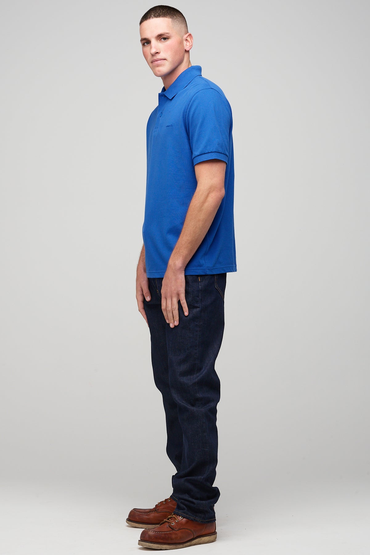 
            male in short sleeve polo shirt - cobalt