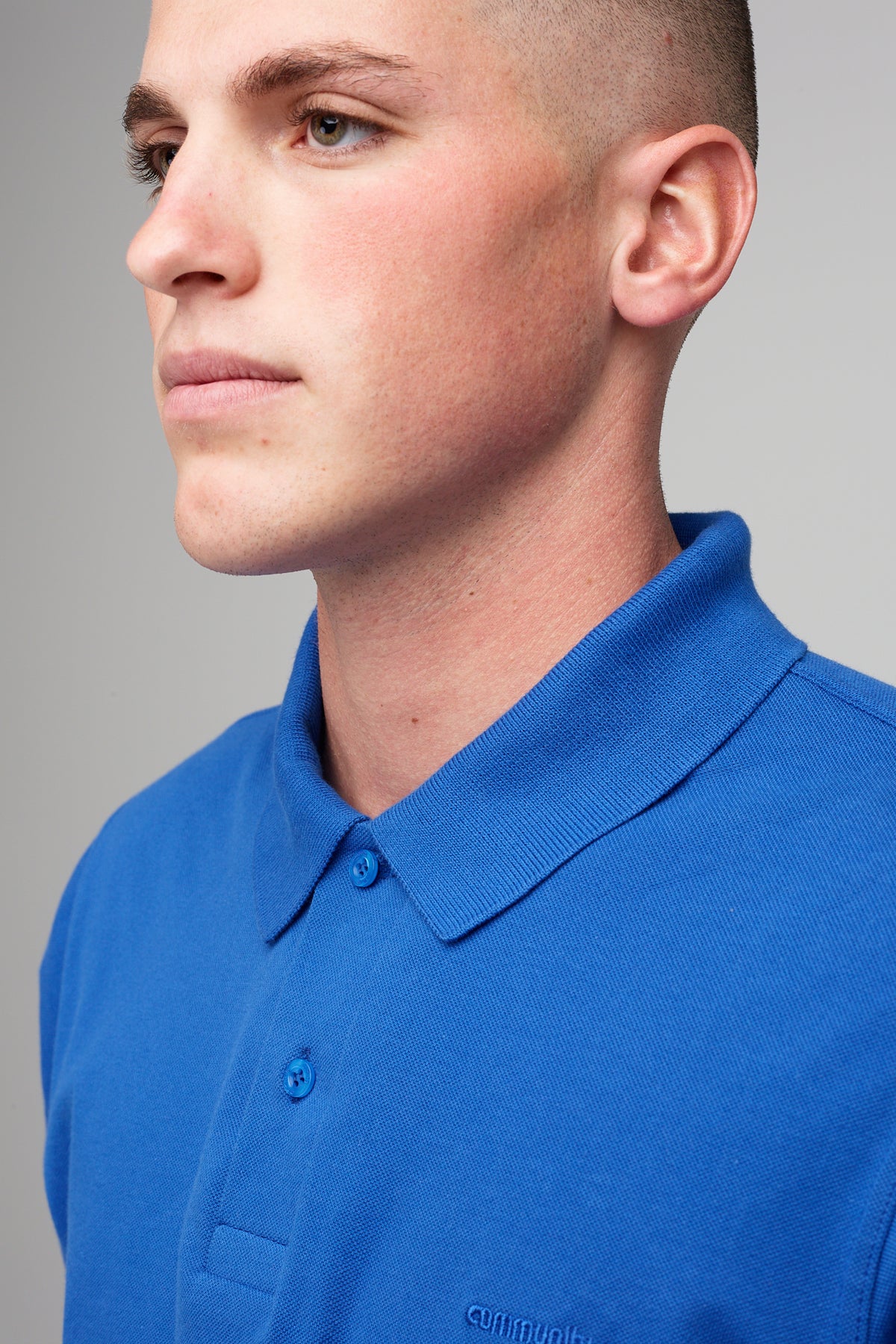 
            male in short sleeve polo shirt - cobalt