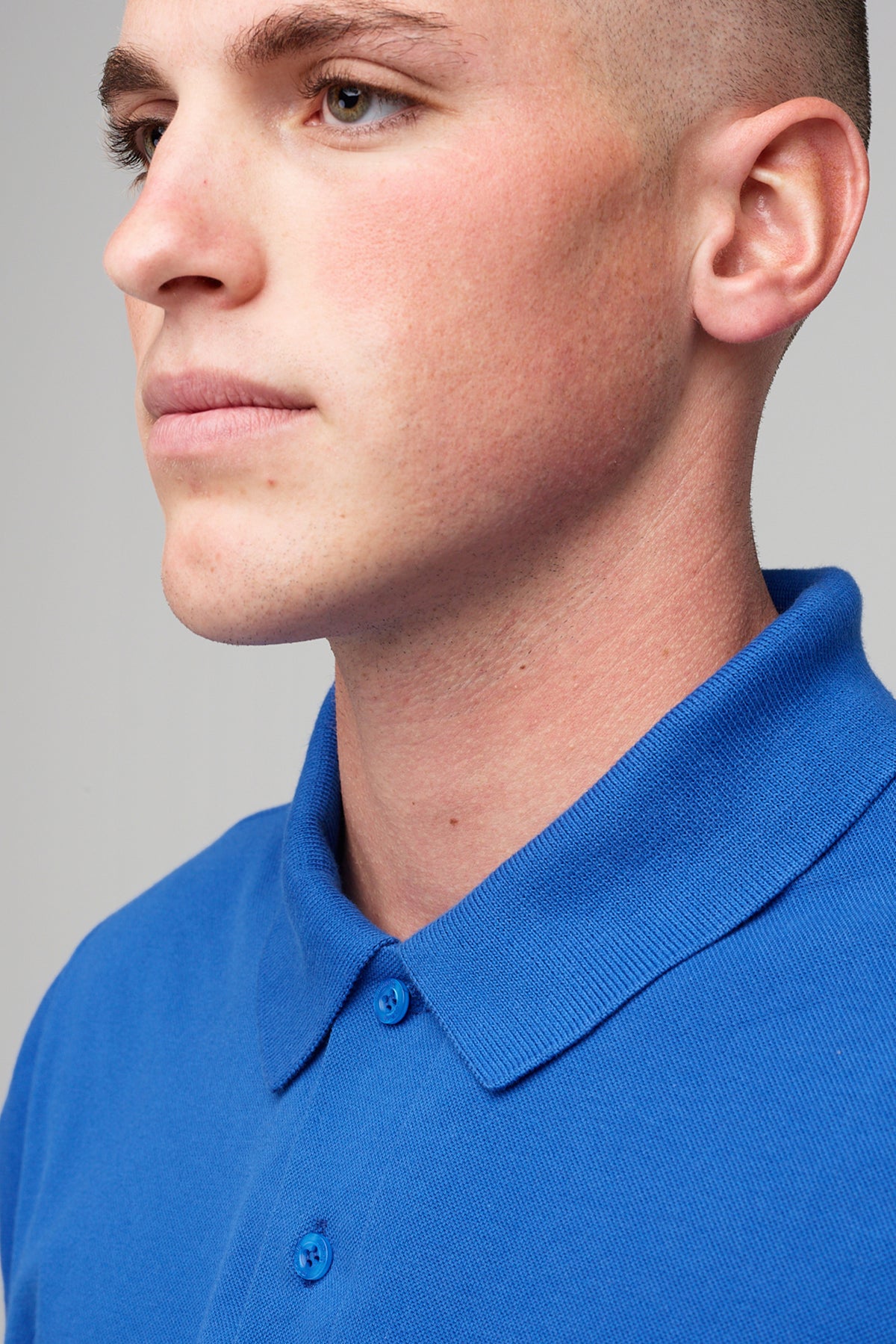 
            male in short sleeve polo shirt - cobalt