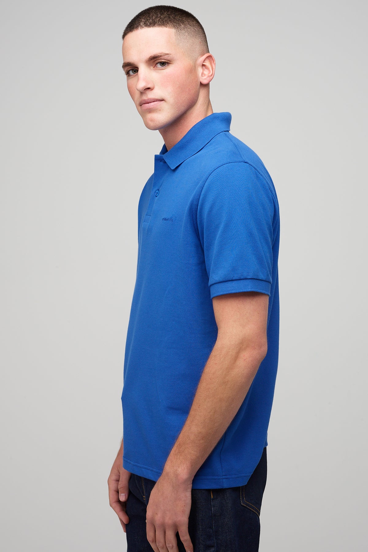 
            male in short sleeve polo shirt - cobalt