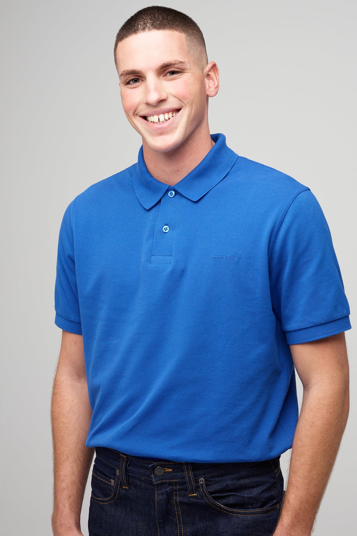 
            male in short sleeve polo shirt - cobalt