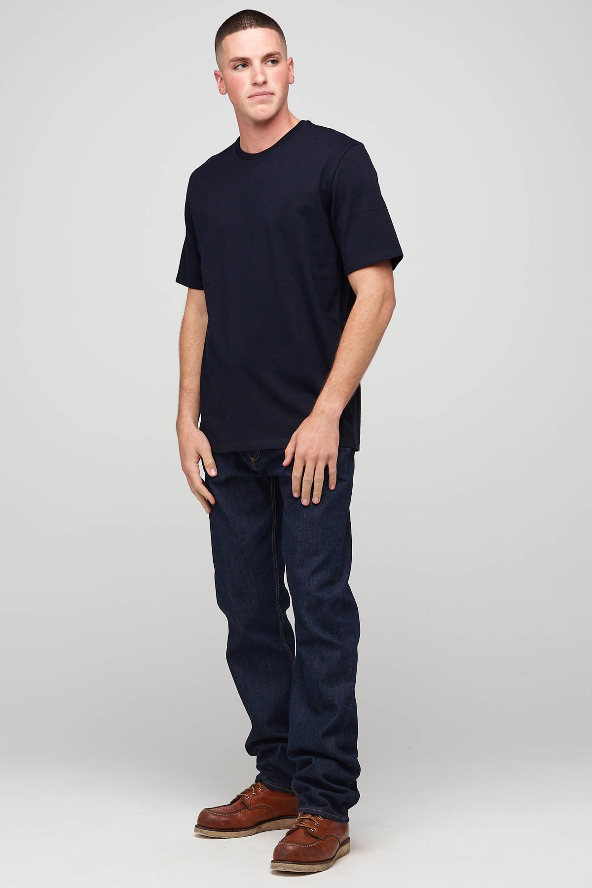 Full body image of the front of male in short sleeve T-shirt Navy