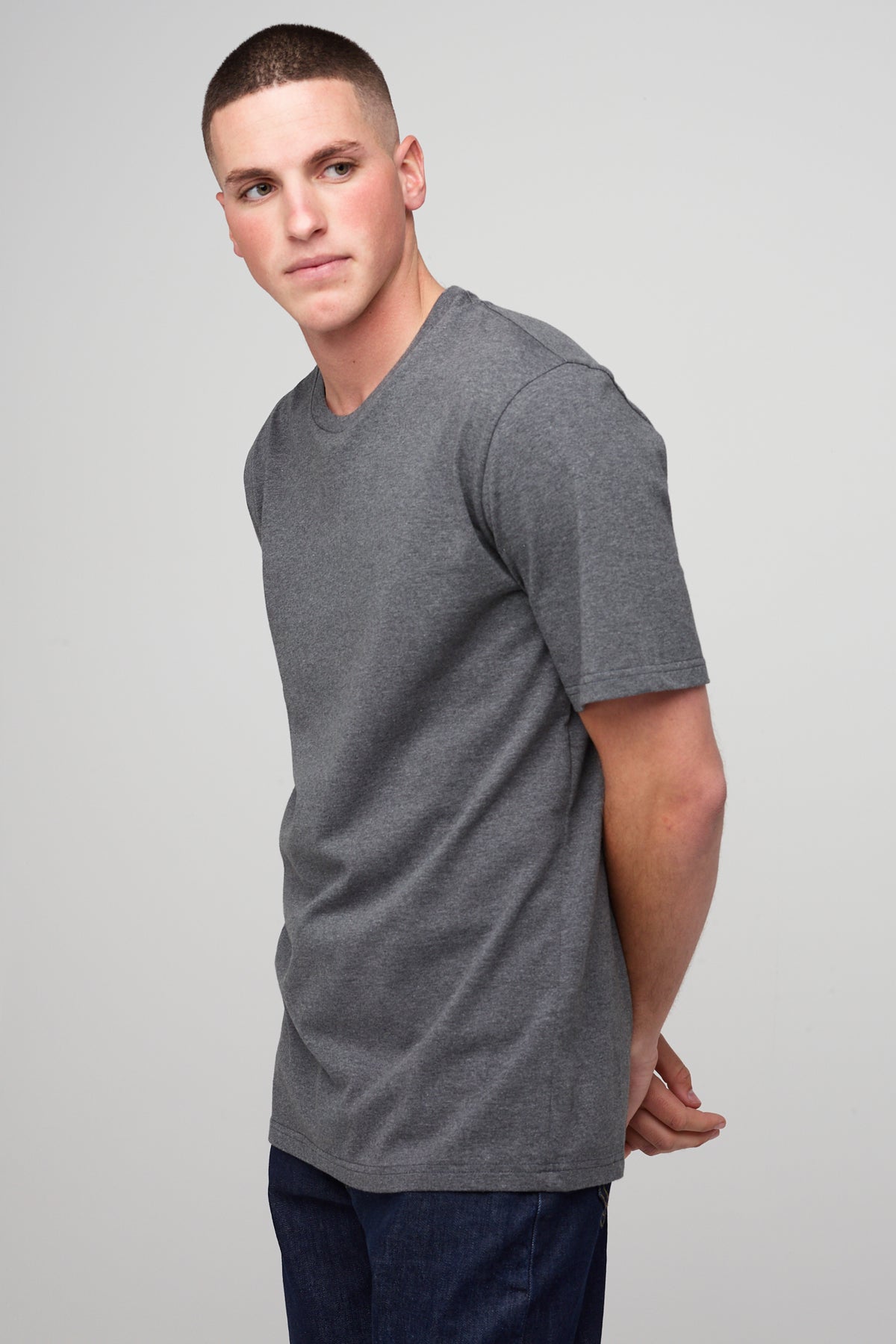 
            brunet, wite male wearing short sleeve t-shirt in charcoal