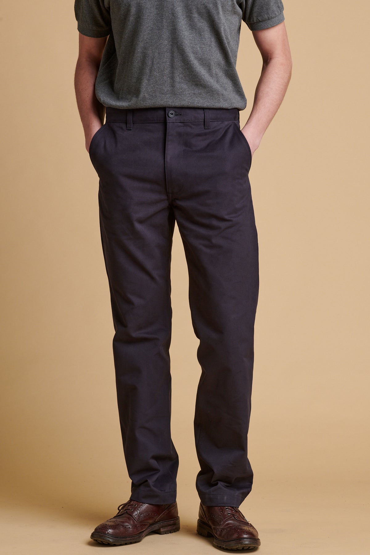 Male wearing slim heavyweight cotton twill chinos in dark navy.