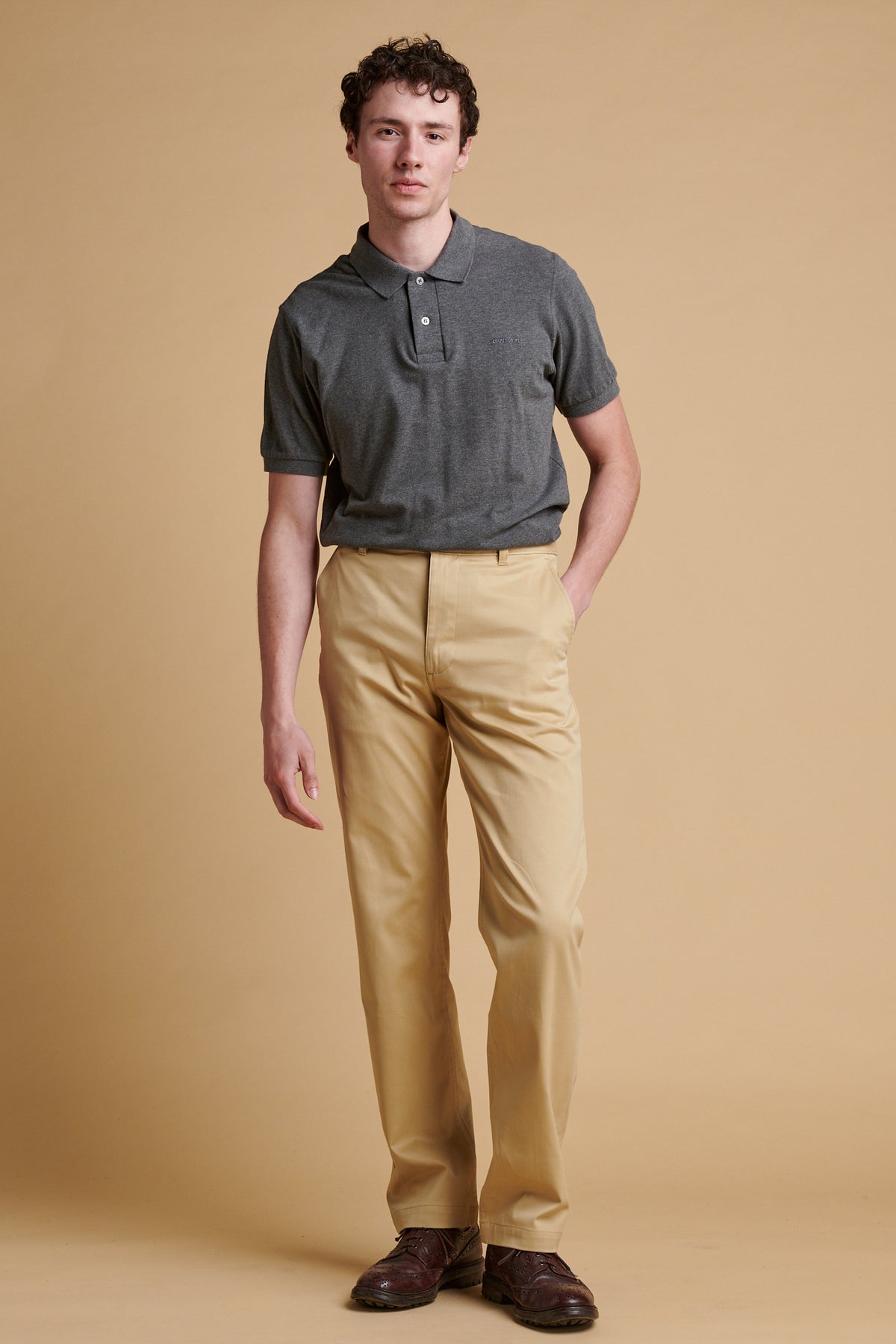 Male wearing slim lightweight stretch chino in stone.