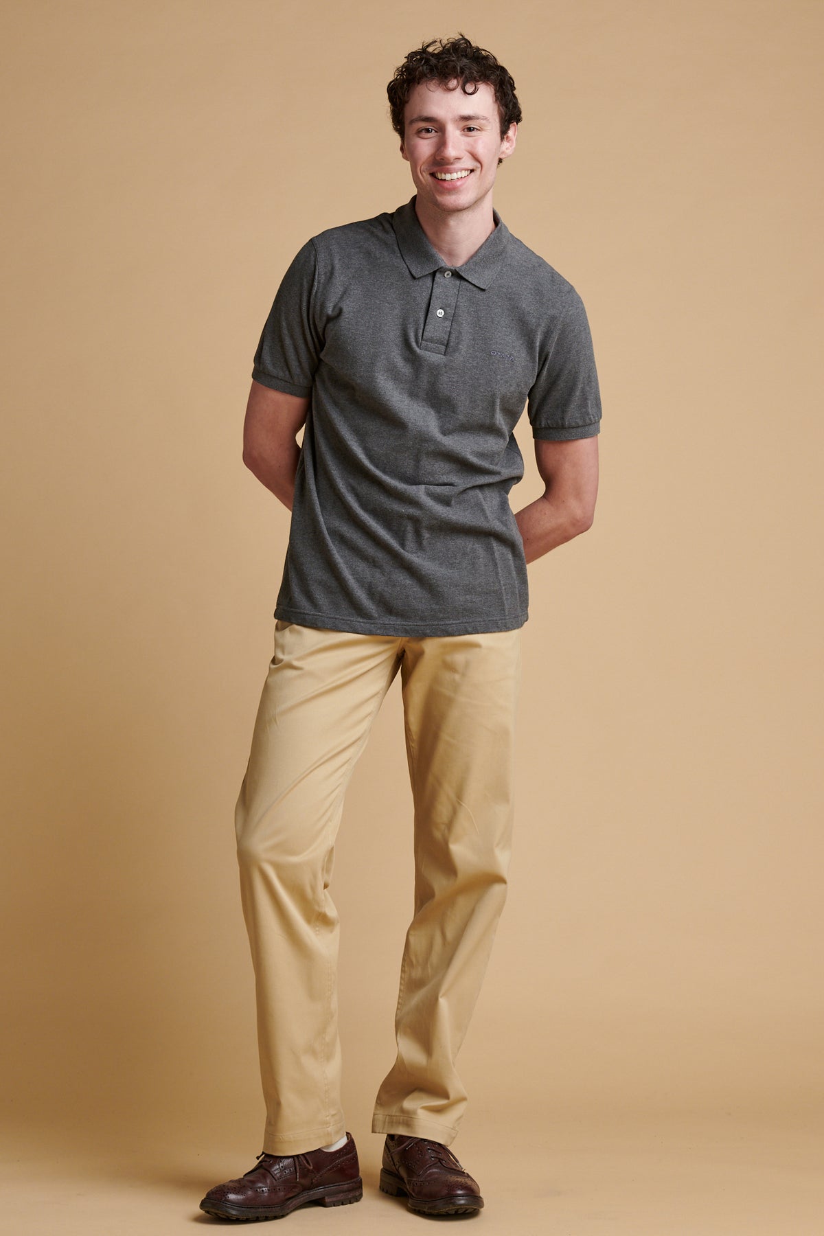 Male wearing slim lightweight stretch chino in stone.