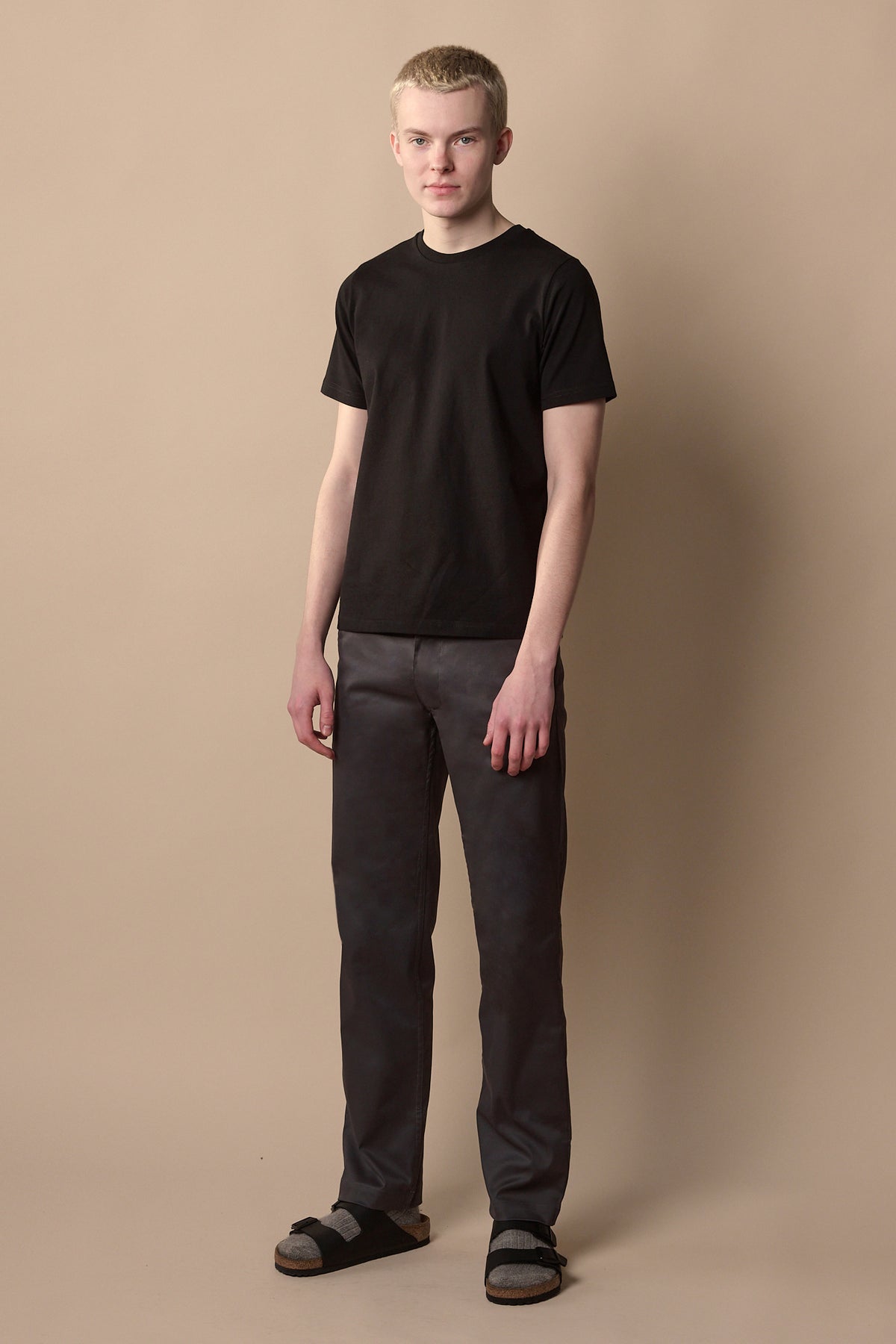 
            Full body image of men&#39;s slim stretch chino in slate grey paired with short sleeve black crew neck t shirt