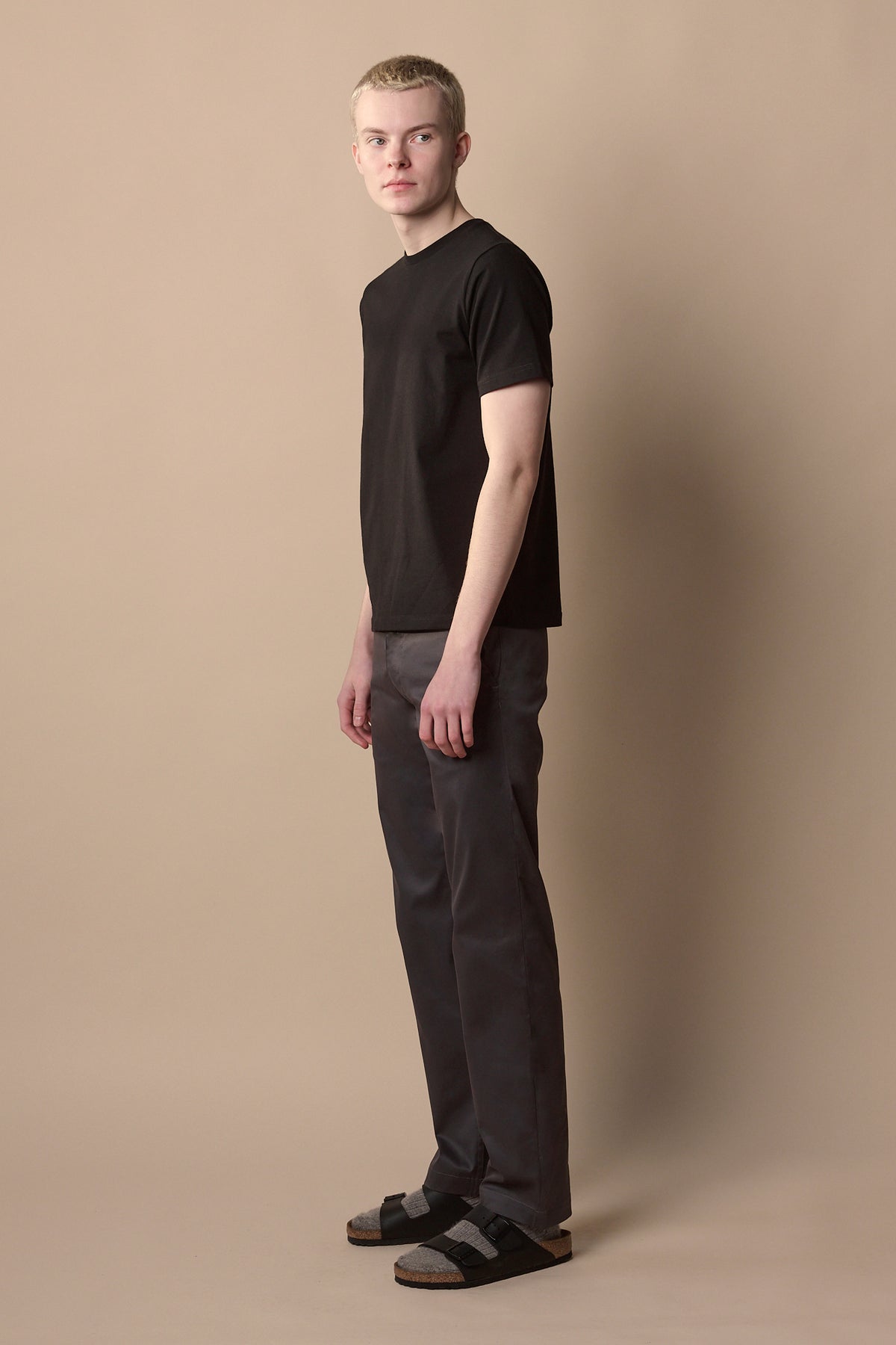 Full body image of men's slim stretch chino in slate grey from the side