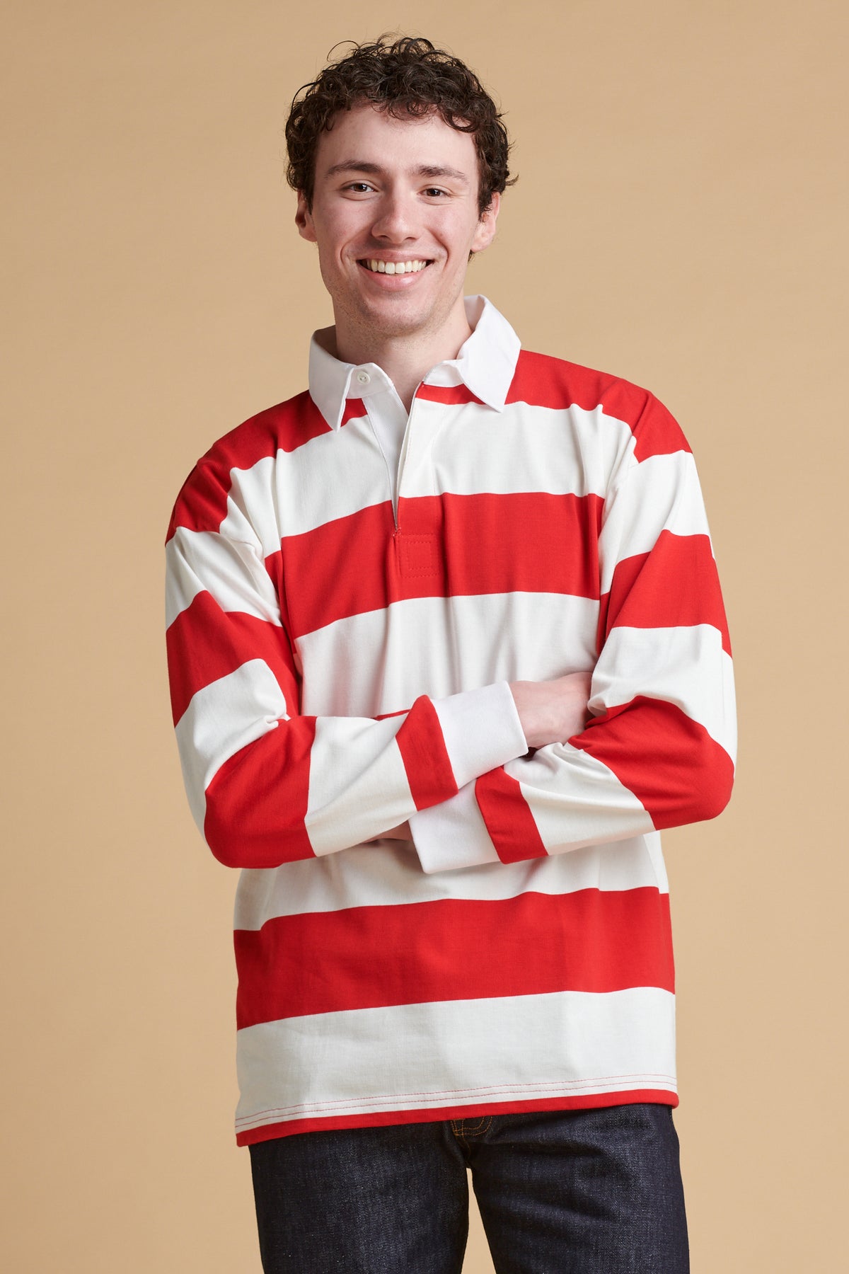 Male wearing unisex striped rugby shirt in red and white.
