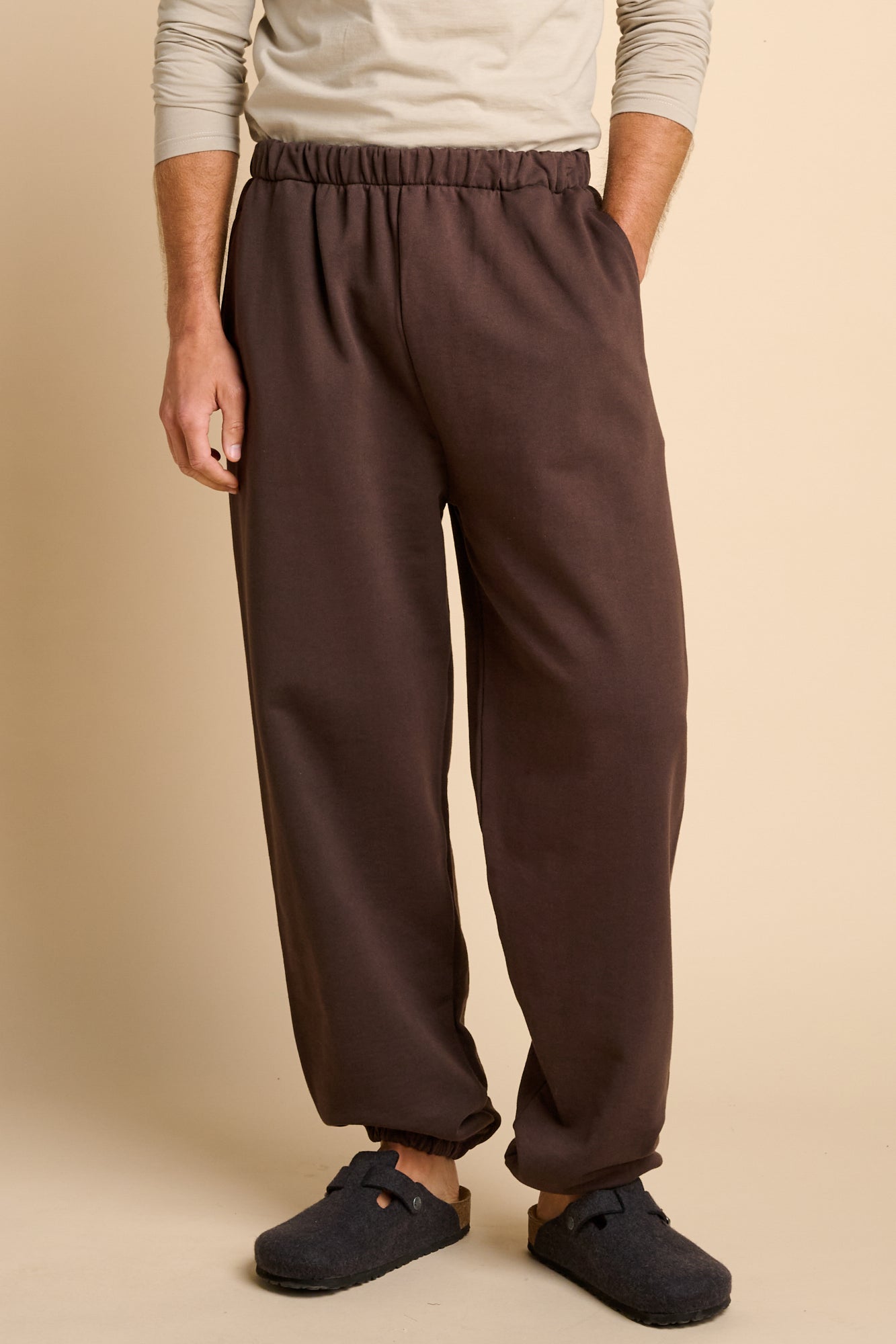 Man wearing chocolate brown sweatpants.