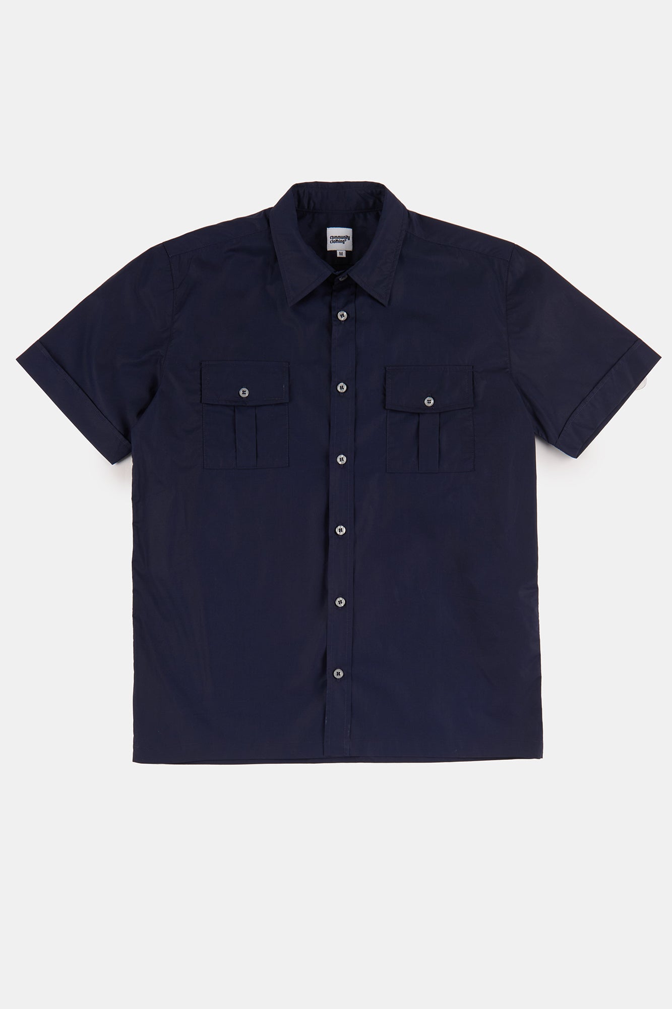 Flatlay product shot of tom short sleeve military two pocket shirt in navy