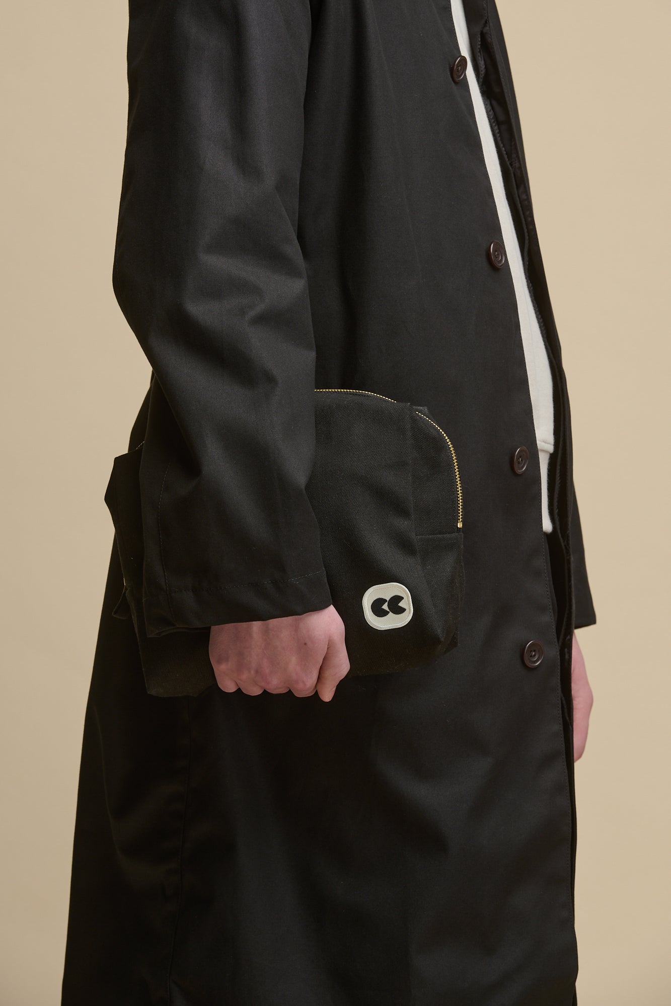 Image of front of medium sized pouch, small CC logo on the bottom right 