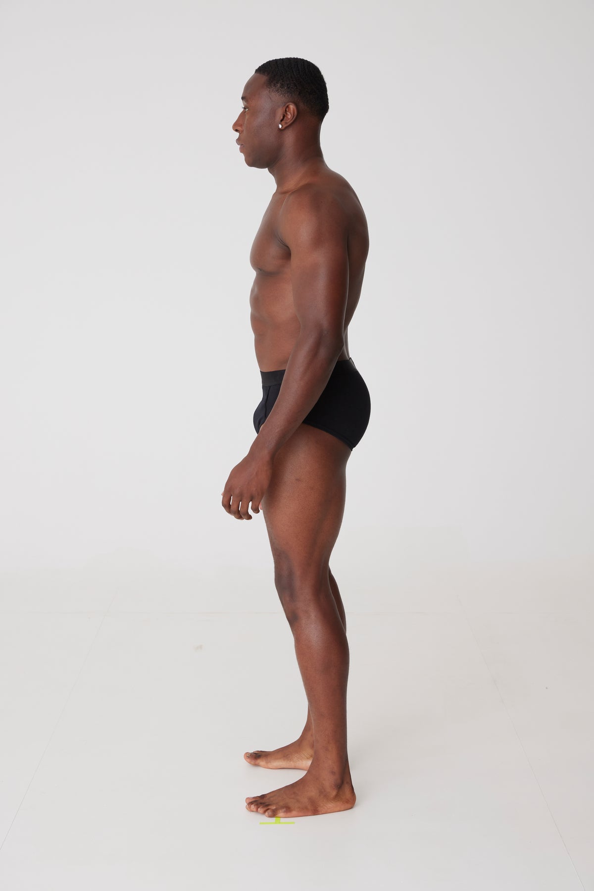 male wearing black y-front briefs side view
